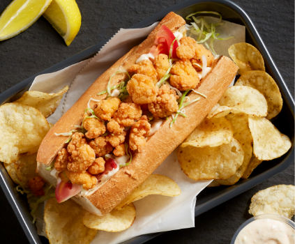 Tyson® Mini Chicken Bites served on a fresh chicken Po’ Boy Sandwich