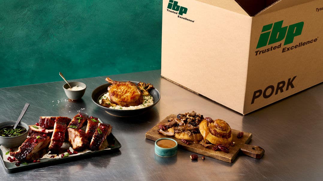 IDP pork box with cooked pork outside of box