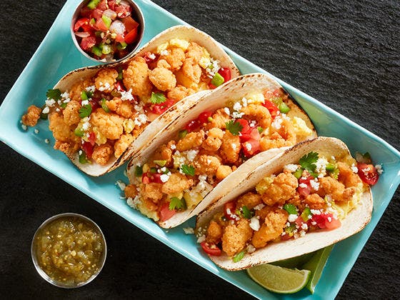 Tyson® Mini Chicken Bites on fresh and crispy breakfast tacos