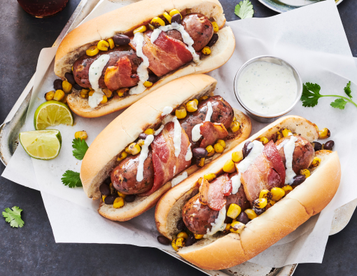 Sonoran sausage wrapped in bacon in a split hoagie bun