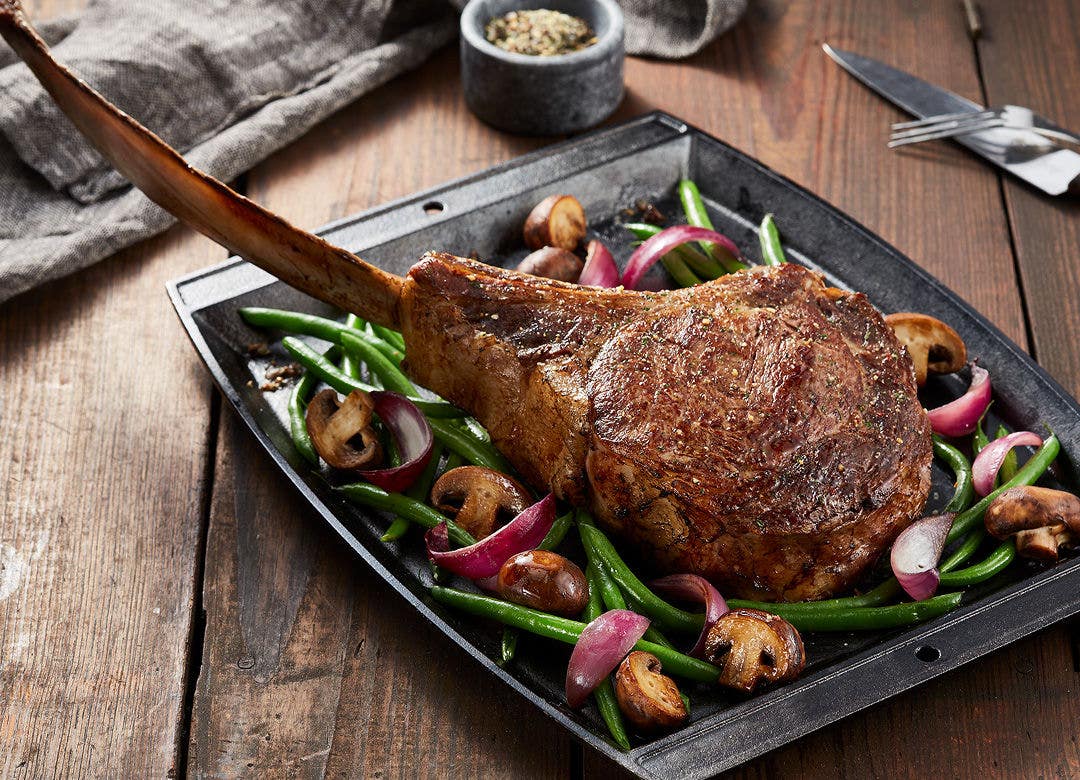Tomahawk Steak menu item in restaurant setting