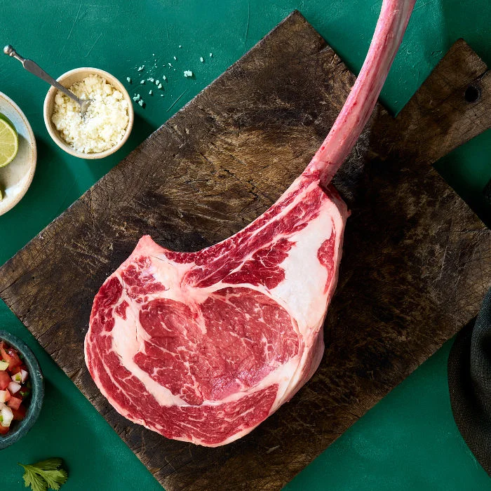 Raw tomahawk beef steak