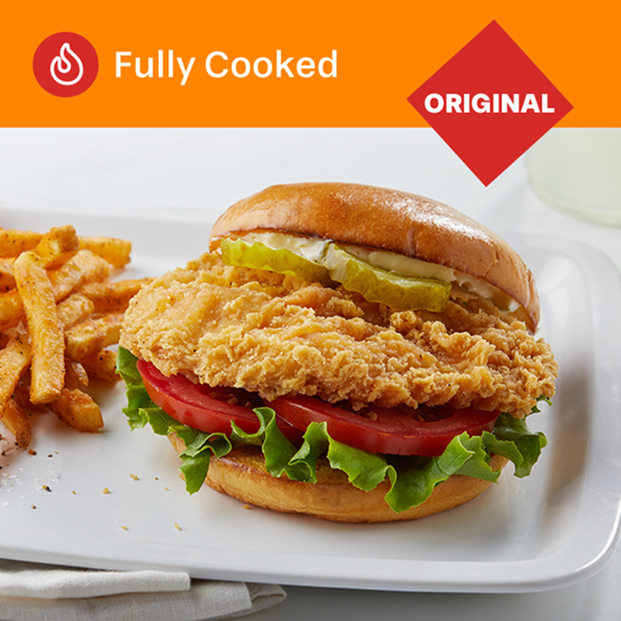 Tyson Red Label® Fully Cooked Breaded Authentically Crispy Original Chicken Breast Filet on a burger bun topped with 2 pickles