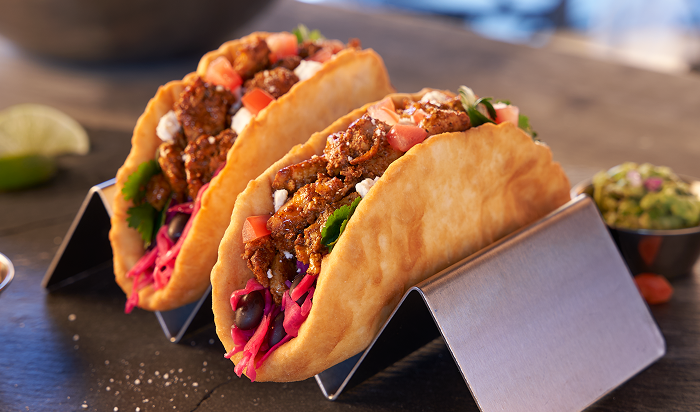 tacos featuring Original Philly® Fully Cooked Topical Seasoned Sliced Beef in restaurant setting