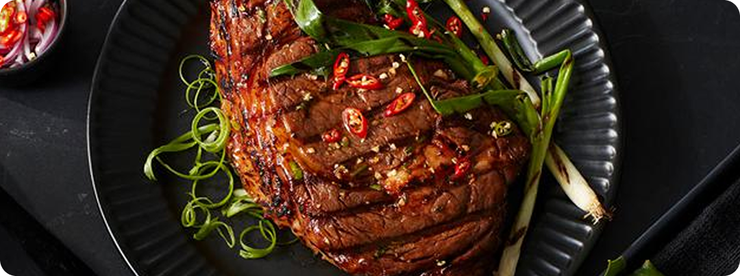 freshly plated beef menu item in restaurant setting