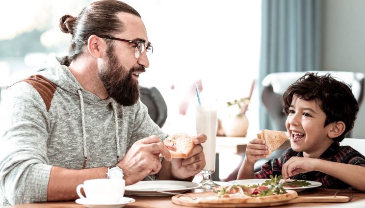 Father and son eating food