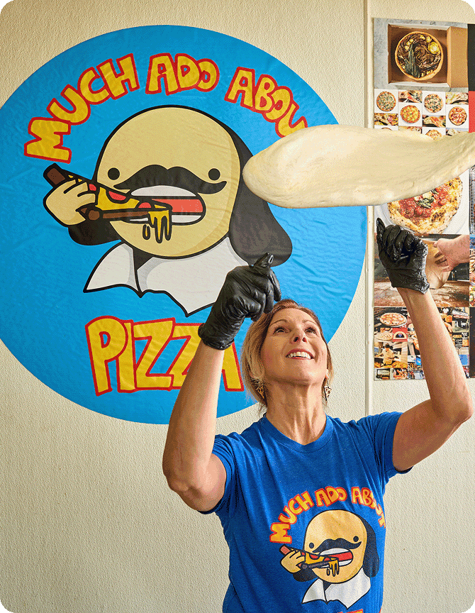 Kira Zabrowski at Much Ado About Pizza twirls a pizza.