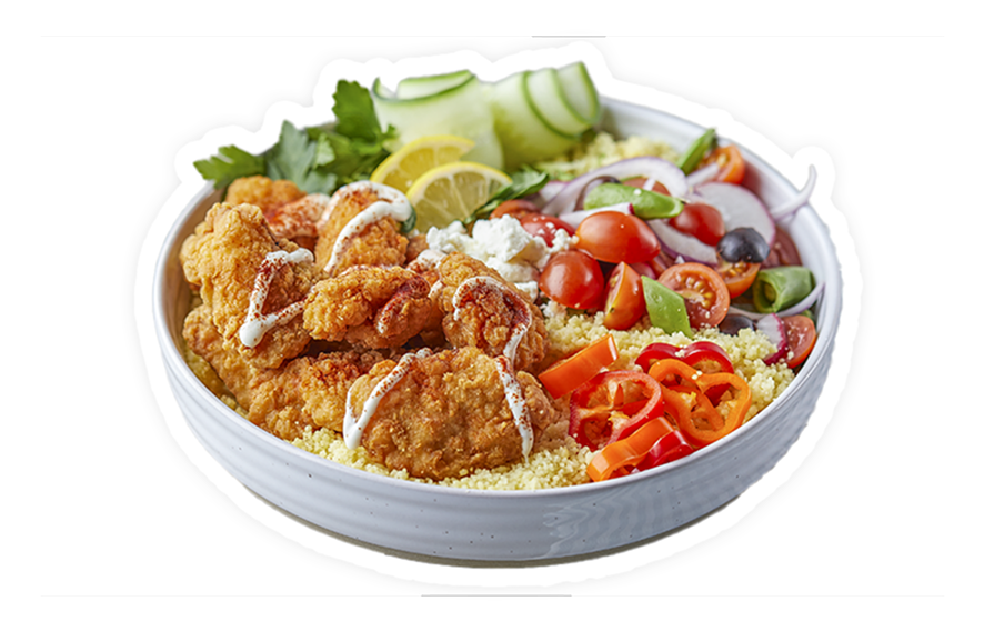 crispy chicken over couscous, lemon slice, cucumbers, tomatoes, olives, peppers, feta, and creamy sauce 