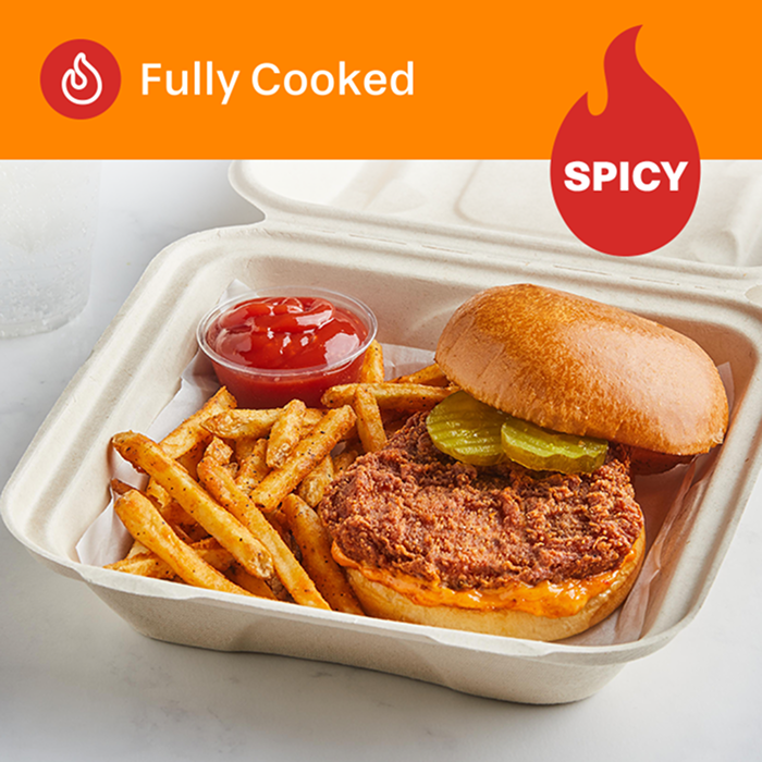 Tyson Red Label® Fully Cooked Breaded Authentically Crispy Spicy Chicken Breast Filets, 5.2 oz. in a to go box with a side of fries and ketchup
