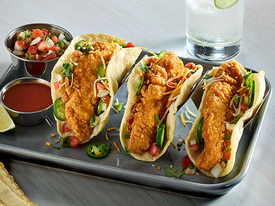 3 gluten-free chicken tenderloin tacos in a crispy tortilla with cheese, pico de gallo and jalapeño