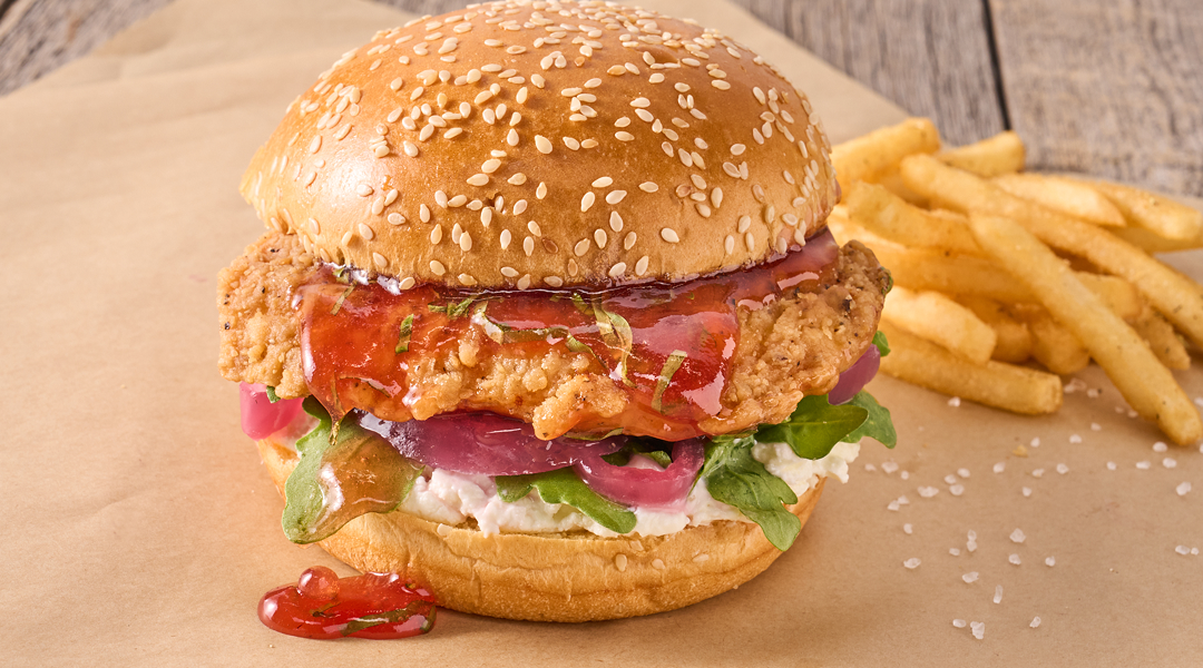 Chicken sandwich topped with strawberry jam