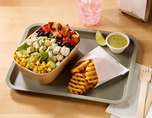 Bowl with grilled chicken, roasted sweet potato, red pepper, black beans, avocado, corn, and lime vinaigrette
