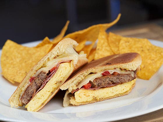 Image of Breakfast Medianoche on a plate with chips.