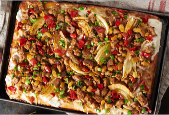 Squared white pizza with sausage, onions and bell peppers