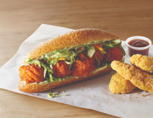 Breaded and glazed boneless chicken wings on a whole-grain hoagie roll with lettuce, cucumbers and carrots 