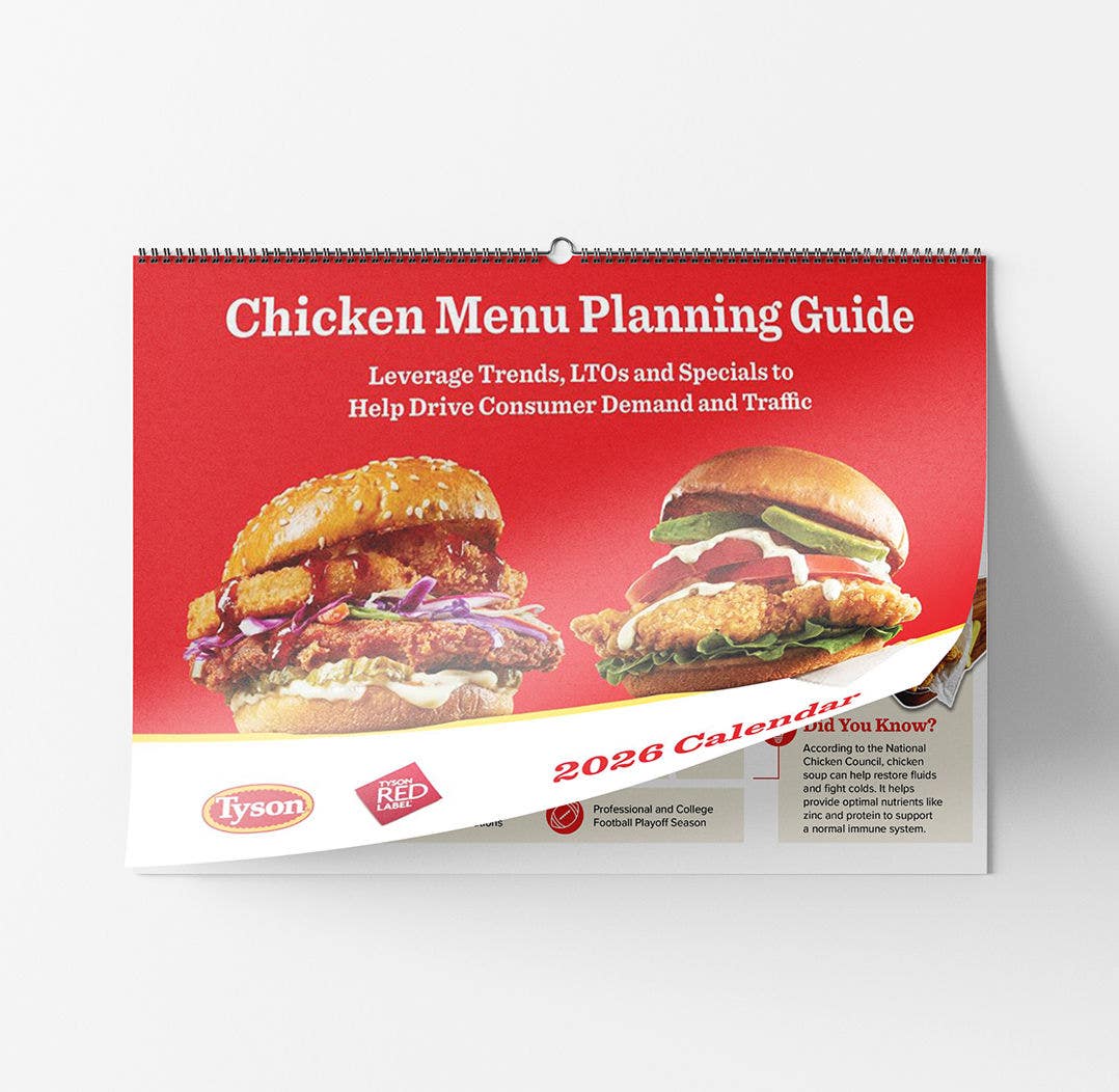 The red cover of a 2026 Tyson wall calendar titled 'Chicken Menu Planning Guide,' featuring two large fried chicken sandwiches