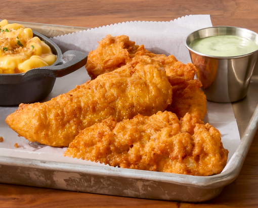 Tyson® Honey Stung® Fully Cooked Lightly Breaded Hot Honey Chicken Tenderloins in restaurant setting