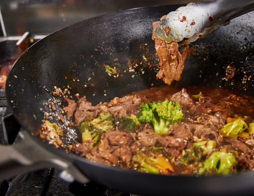 Sirloin Beef Flat Steak with Broccoli tossed with soy ginger garlic sauce and garnished with sesames