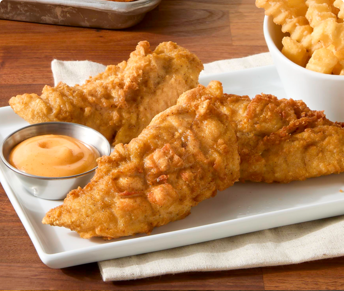 Tyson® Honey Stung® Fully Cooked Lightly Breaded Original Honey Chicken Tenderloins on plate 