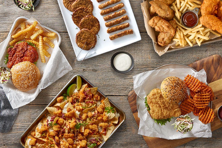 Menu-ready fried chicken sandwiches, chicken nachos, sausage, wings, and sides ideal for foodservice operations.