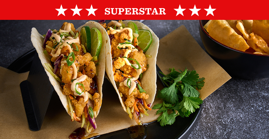 Crispy chicken bites in tortillas with Asian slaw, soy ginger sauce, and wonton chips on the side
