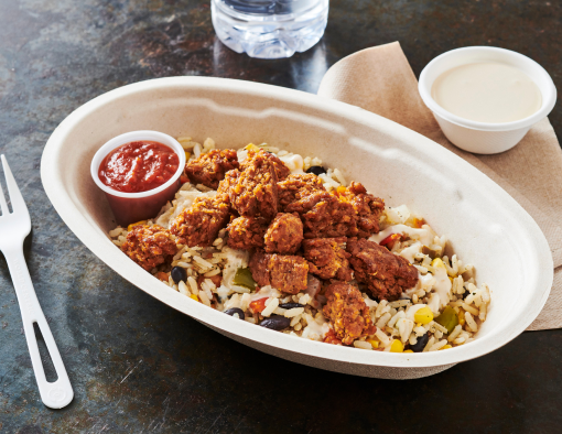 Seasoned chopped chicken served over cilantro lime rice with queso, salsa de guajillo in disposable dish 