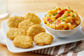 Tempura nuggets with a side of maccaroni and cheese with bacon. 