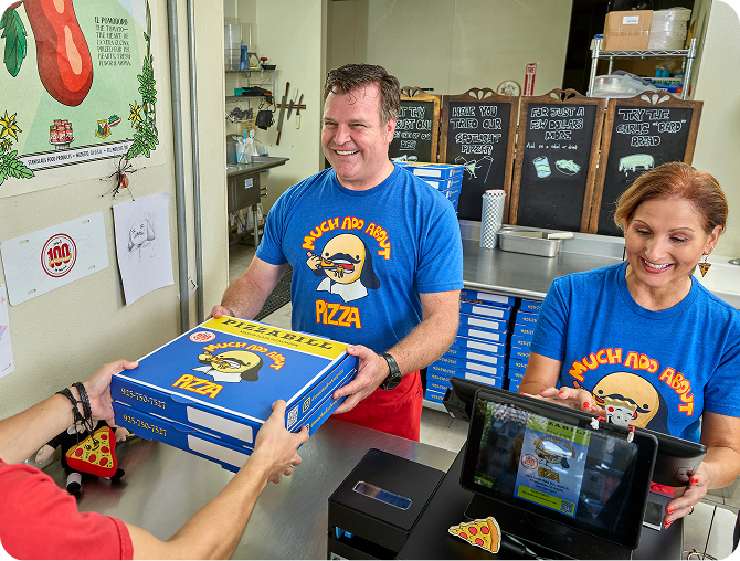 Kira and Mark ring up a pizza order.