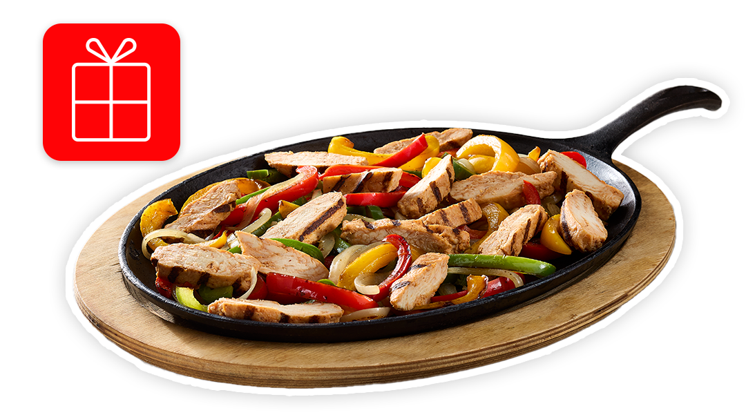 Sizzling chicken fajitas in a cast-iron skillet, with a red gift box icon