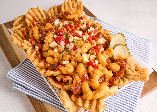 waffle cut hashbrowns topped with chicken bites