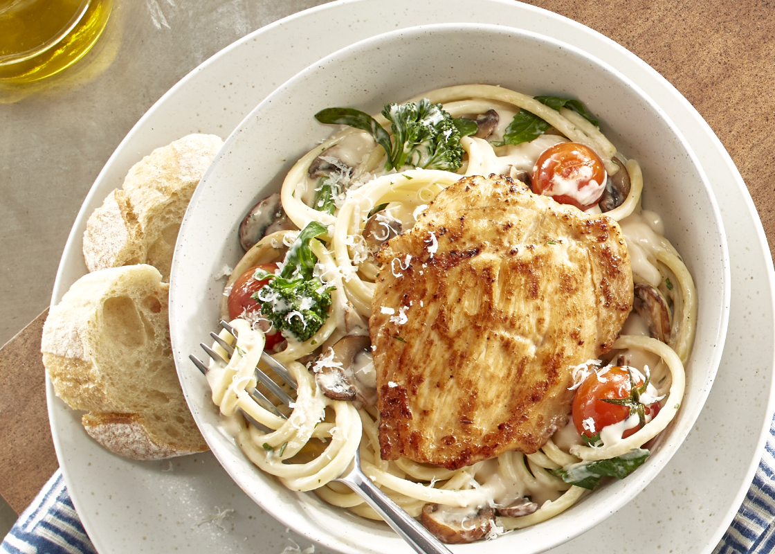 Appealing image of Tyson Red Label® Precision Cooked™ All Natural* Sous Vide Chicken Breast Filets served as part our Cremini Chicken Pasta recipe.