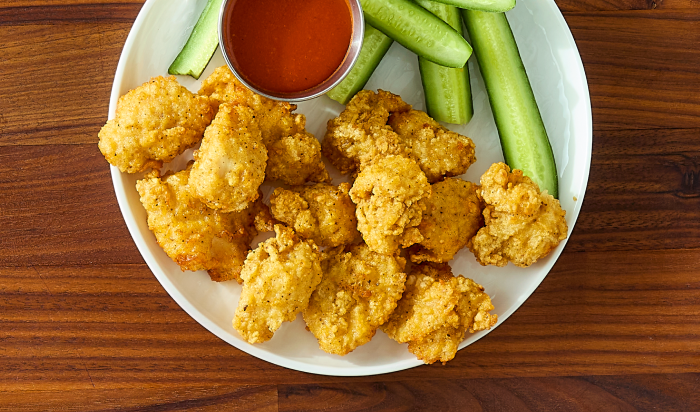 Tyson® Honey Stung® Fully Cooked Lightly Breaded Original Honey Chicken Breast Chunks in restaurant setting