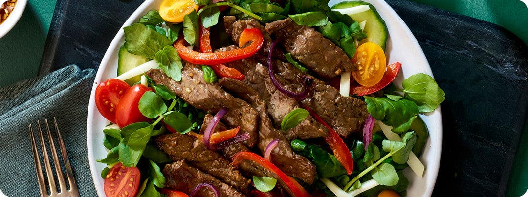 plated Vietnamese Shaking Beef Salad Steak menu item
