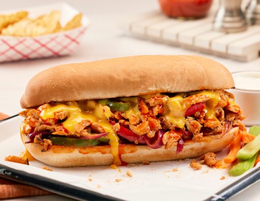 toasted hoagie with marinated chicken, sautéed veggies, blue cheese mayo, and melted American cheese sauce