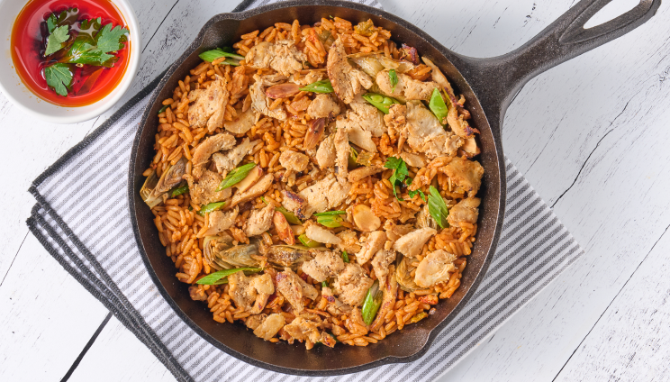 chicken and rice in a cast iron pan