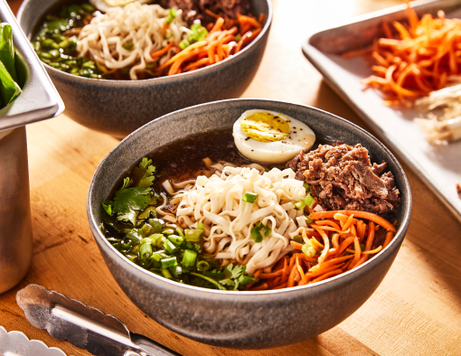 Beef broth is simmered with garlic, ginger, fish sauce, soy sauce and rice wine vinegar