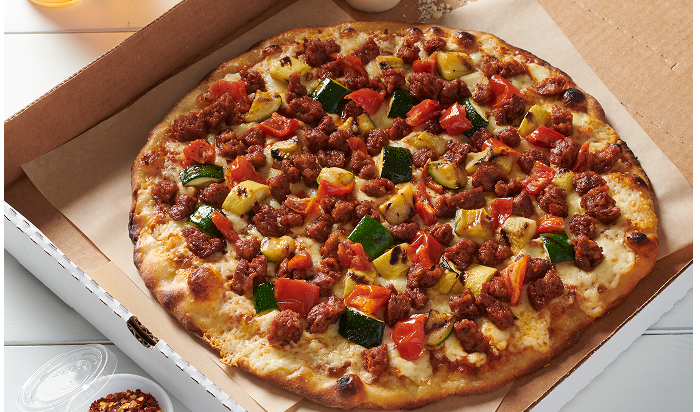 pizza featuring Hillshire Farm® All Natural* Fully Cooked Pork Chorizo Crumbles on table