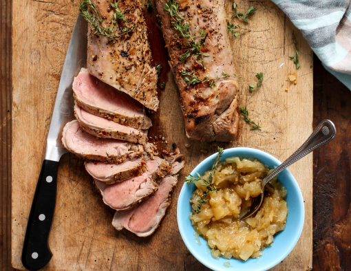Grilled and Sliced Pork Tenderloin with Apple Onion Jam on a Board