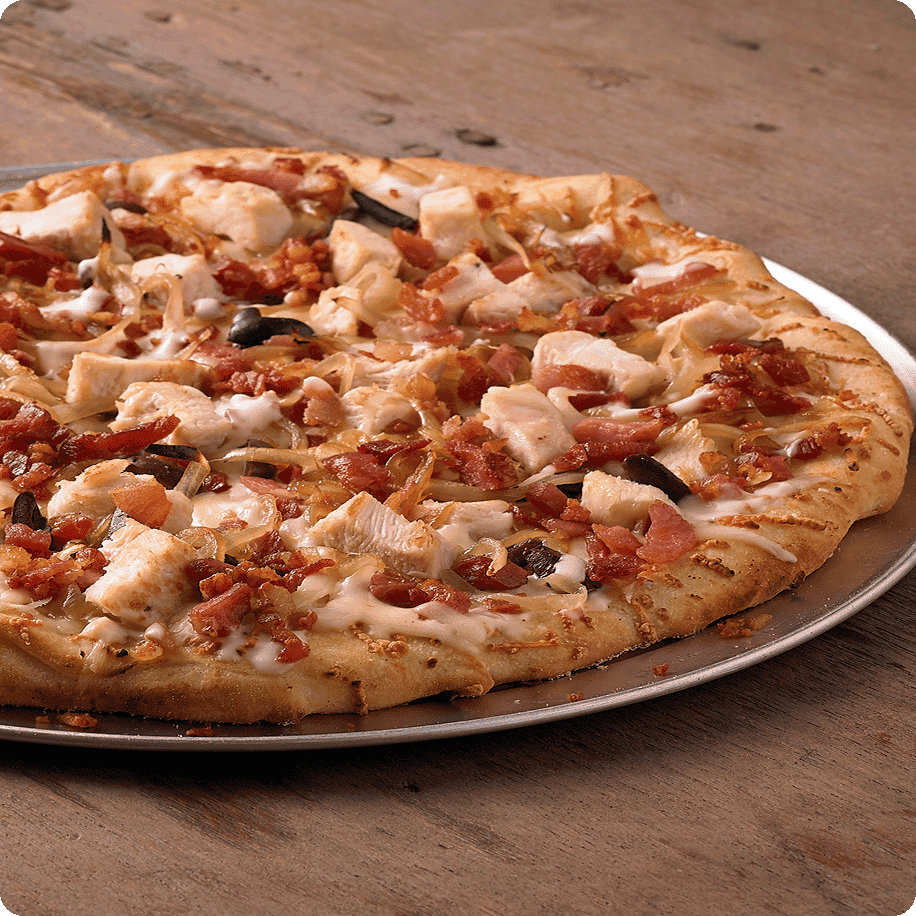 Pizza topped with chicken and bacon