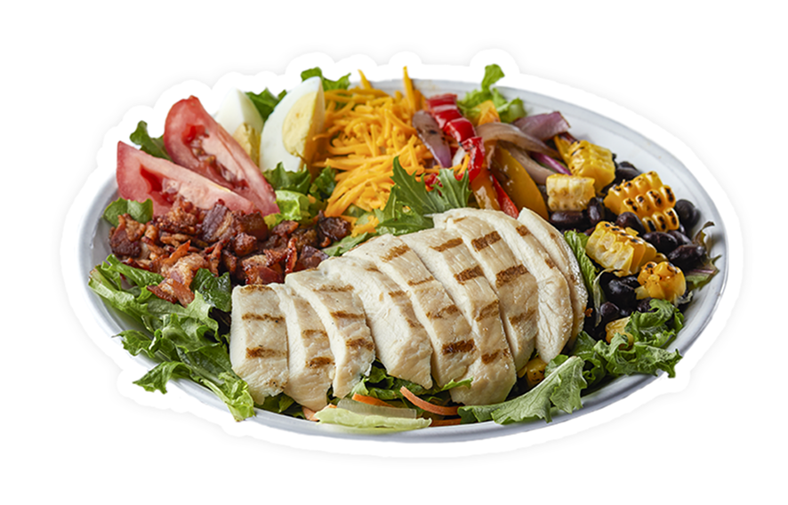 Southwest salad with grilled chicken slices, mixed greens, tomato wedges, egg, cheddar, corn, peppers, and black beans