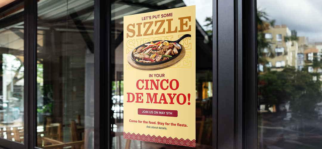 Cinco de Mayo promotional poster on the poster on the front door of a neighborhood restaurant