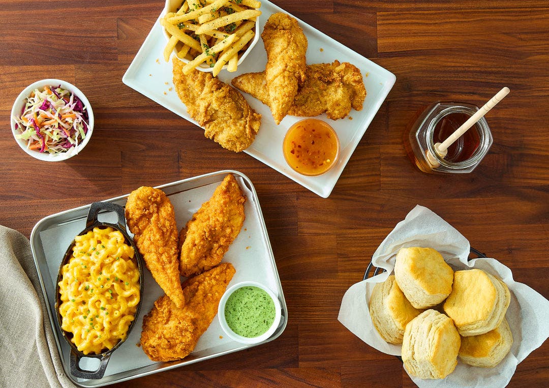Chicken tenders, seasoned fries, mac and cheese, biscuits, slaw, and dipping sauces