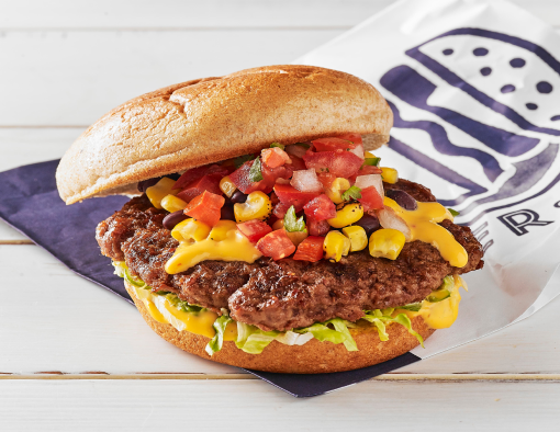 Grilled beef burger with queso, black beans, corn salsa and Pico de Gallo on whole grain bun