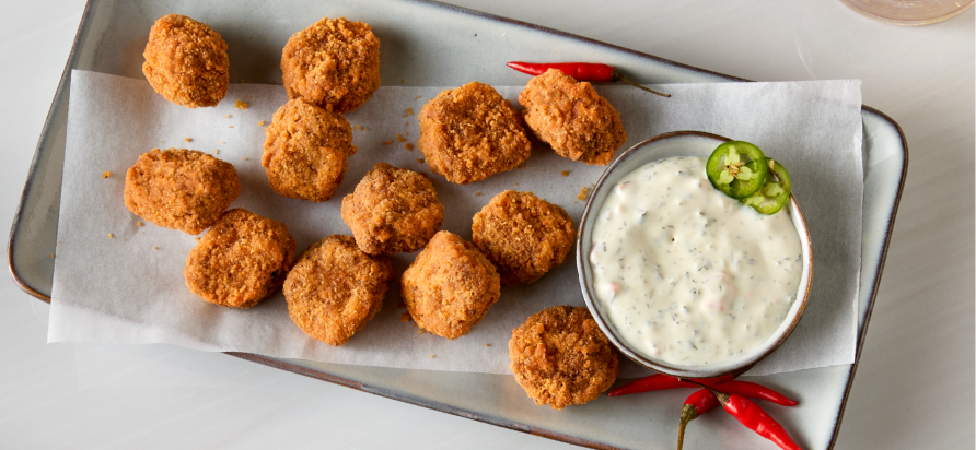 State Fair® Hot & Spicy Uncooked Breaded Beef Bites in restaurant setting