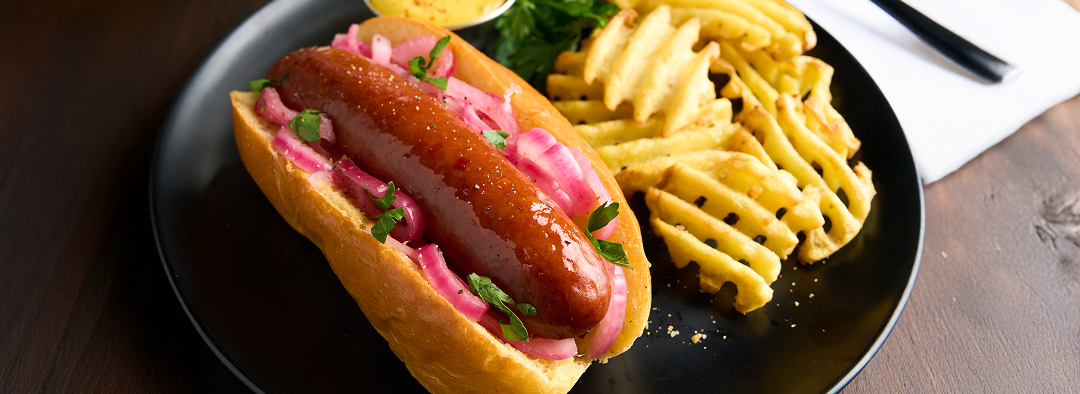 plated Black Oak™ Smoked Sausage with waffle fries on plate