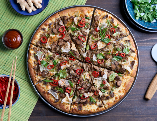 golden crispy pizza crust topped with Sliced Beef, pho cream sauce, mozzarella cheese, pickled Fresno peppers