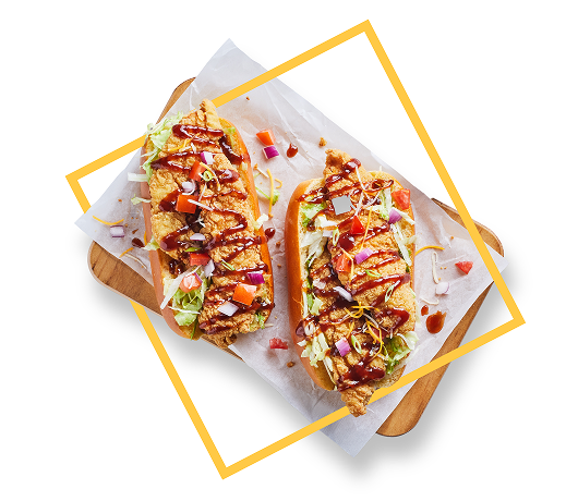 Chicken tenders sandwich with fresh toppings and drizzle