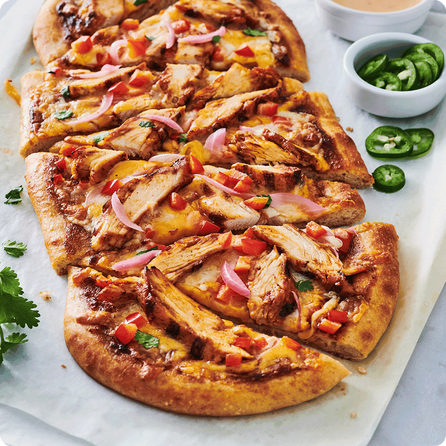 Flat bread pizza topped with sliced chicken