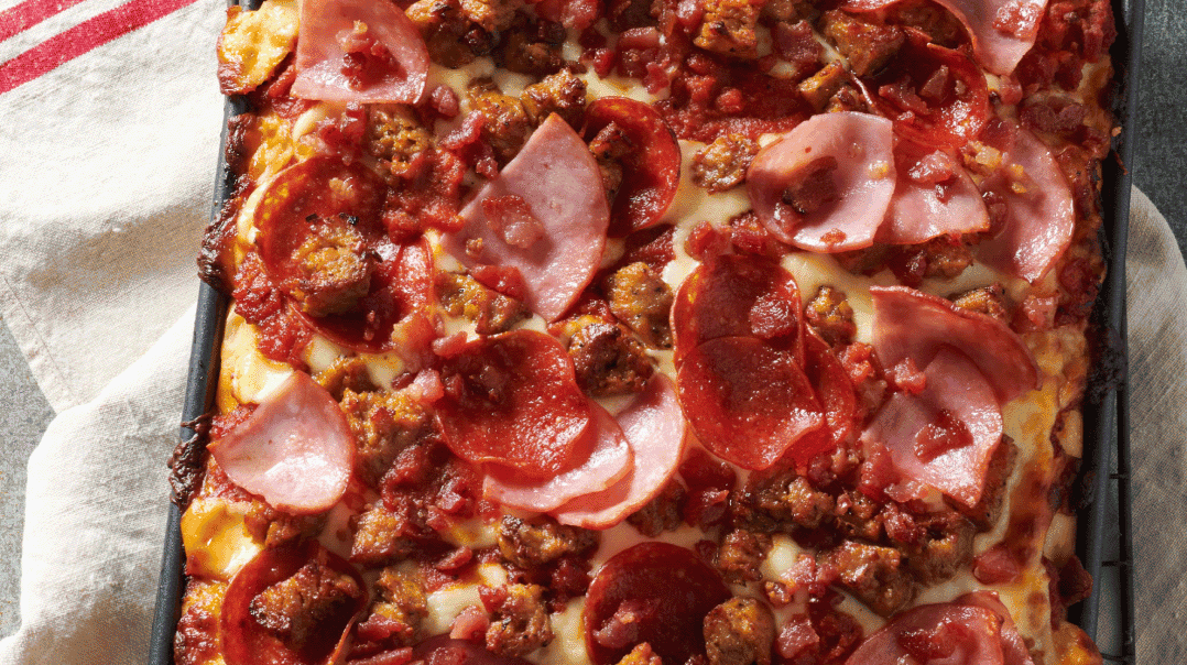 pizza toppings on a square dish pizza.