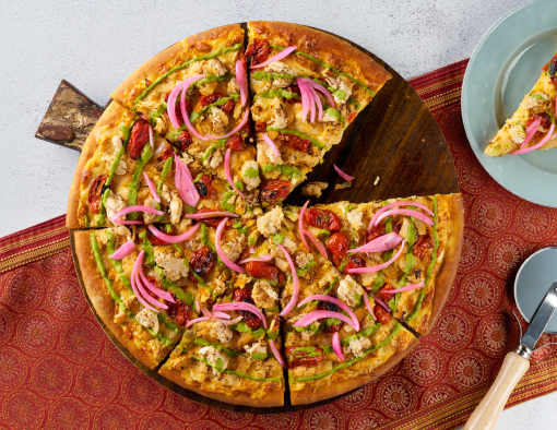 golden crispy pizza crust topped with Indian butter sauce, tandoori marinated chicken featuring Original Philly® Sliced Chicken